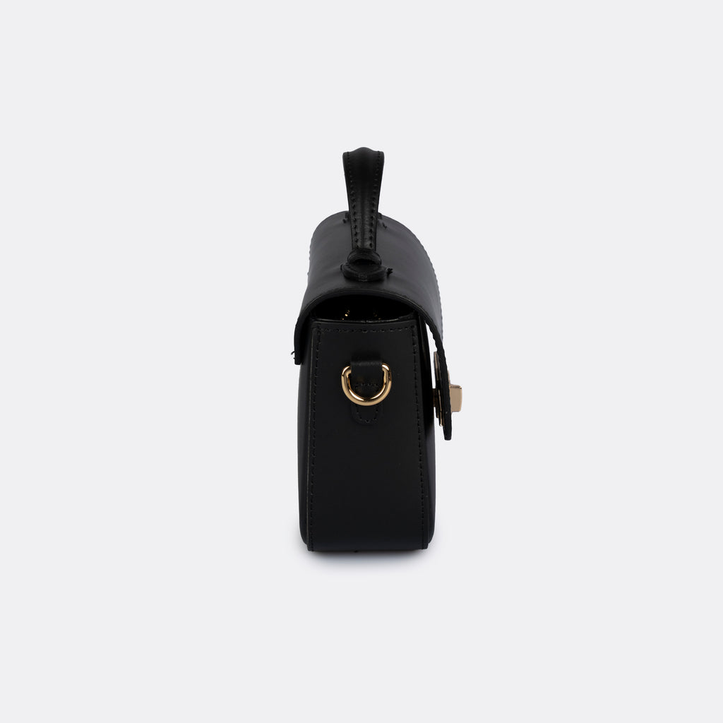 Black Italian leather top-handle bag with gold-tone hardware, the ARVÉRO Capri