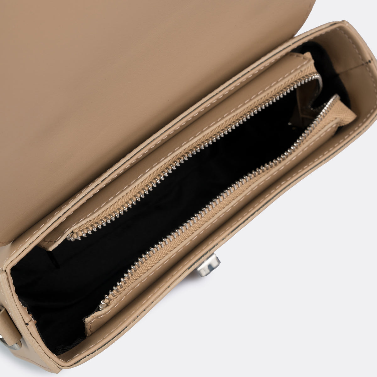 Compact taupe top-handle bag in Pelle Ruga leather with silver-tone turn-lock bar, the Capri