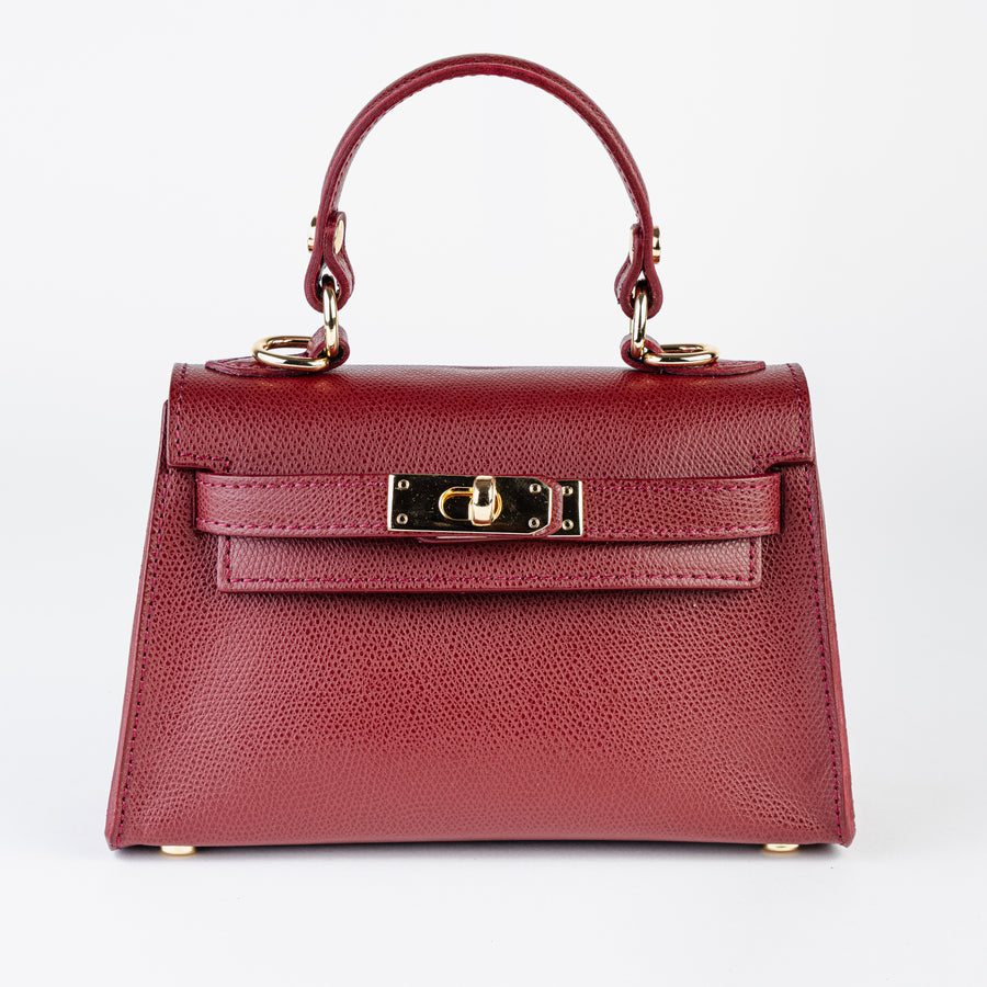 Vicenza Mini in burgundy Epsom leather with a front flap and gold hardware by ARVÉRO