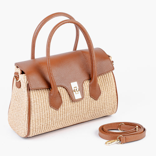 Front view of the Firenze satchel showing the structured raffia front