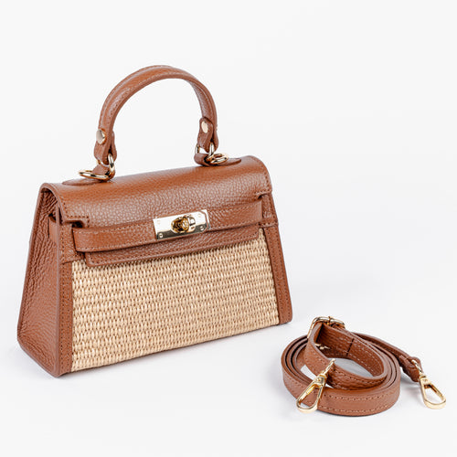 Front view of the Mini Firenze bag showing the raffia front panel and leather frame
