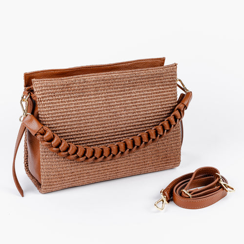 Front view of the Amalfi clutch showing the woven raffia front and braided handle